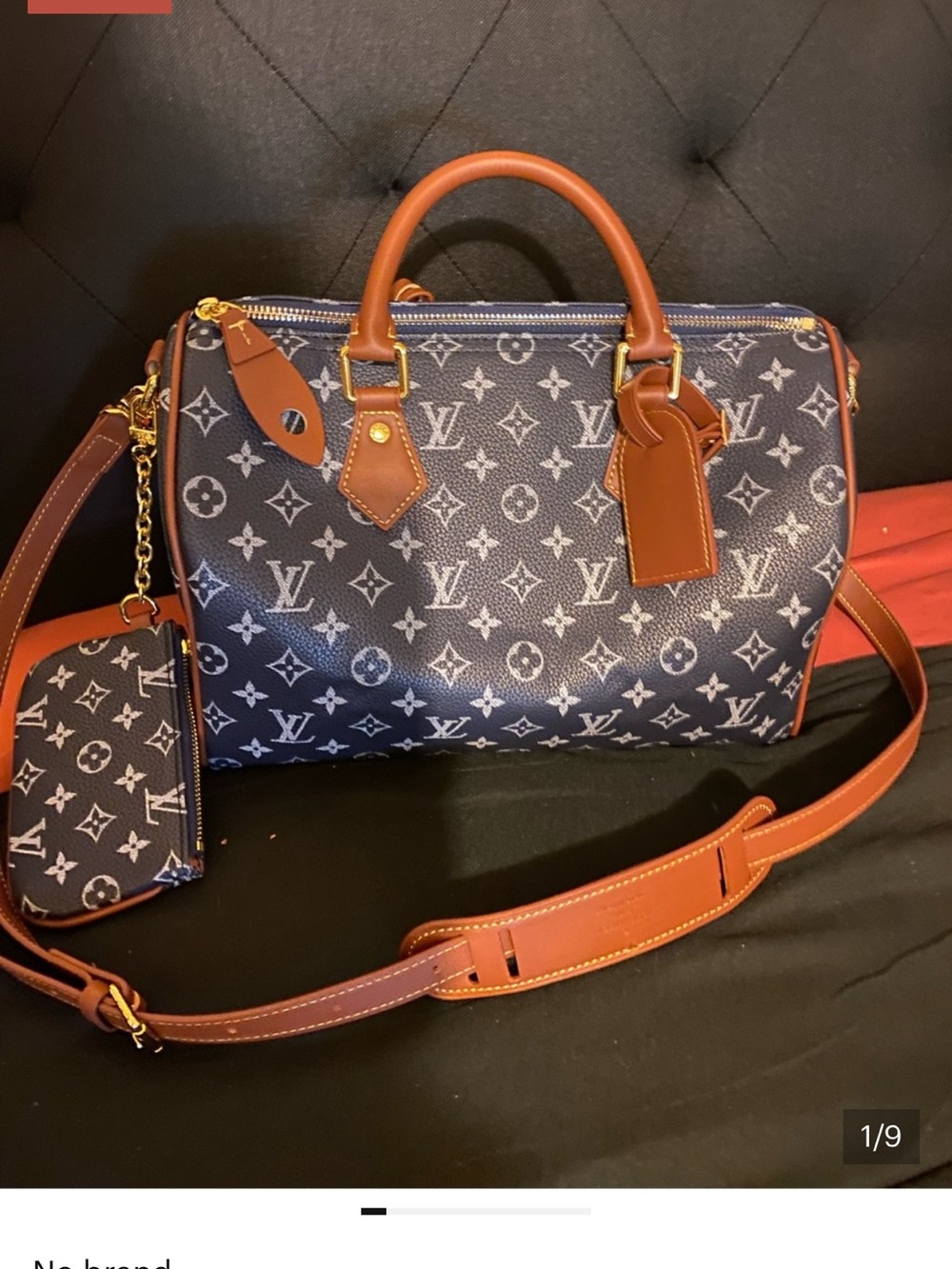 NOT AUTHENTIC Louis Vuitton Navy Monogram Satchel with Brown Leather Trim.